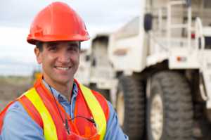 man in High visibility clothing near plant machinery